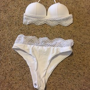 White bathing suit with white lace